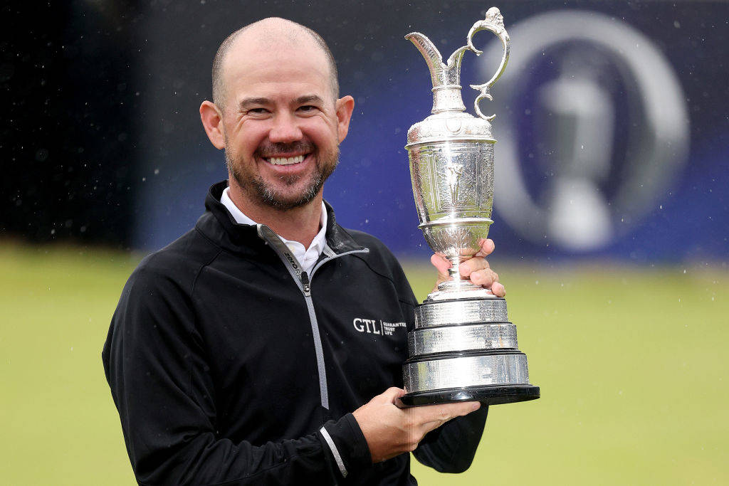 A joyous Harman with the Claret Jug